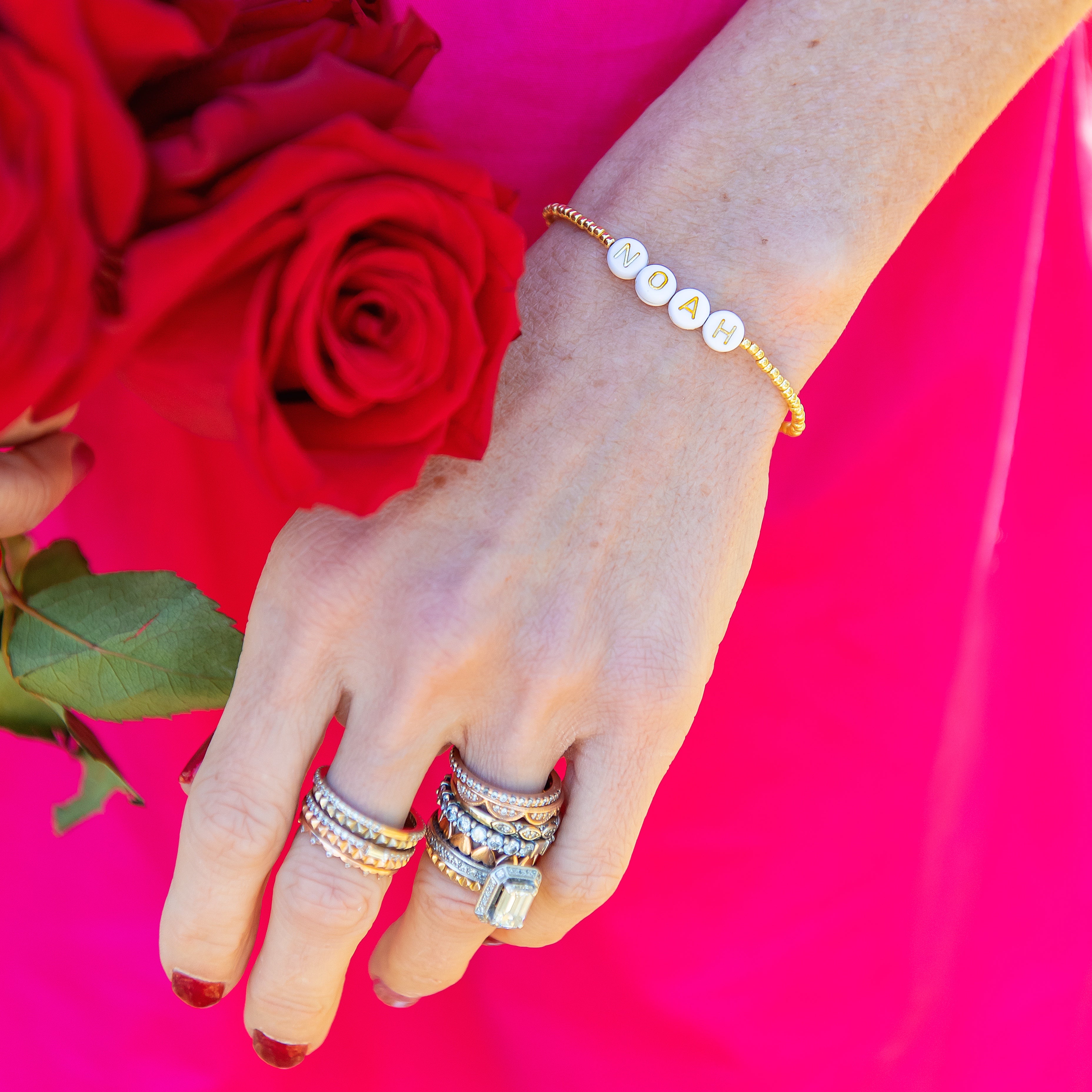 Pink 18K Gold beaded bracelet stack with custom letter beads
